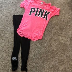 Pink Victoria’s Secret shirt and capri pants